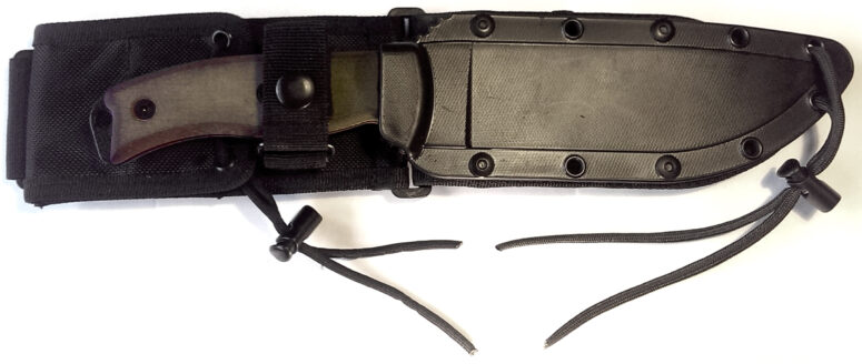 ESEE-6 in the plastic sheath. Pommel folding cover clearly visible.