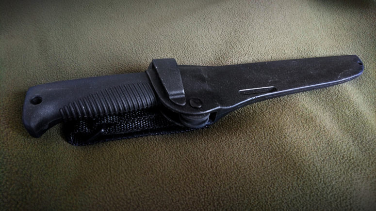 The plastic version of the sheath, with the Rotating Rubber Retention mechanism to secure the knife visible.